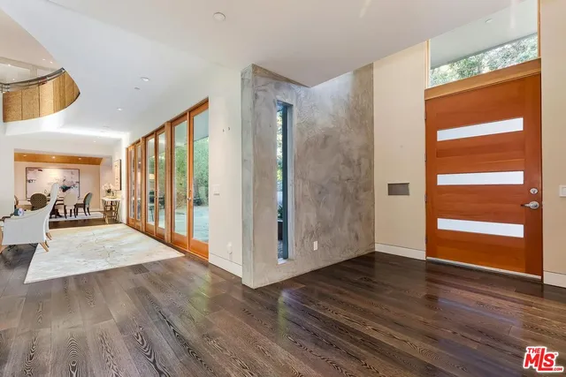 a view of a hallway view with wooden floor and staircase