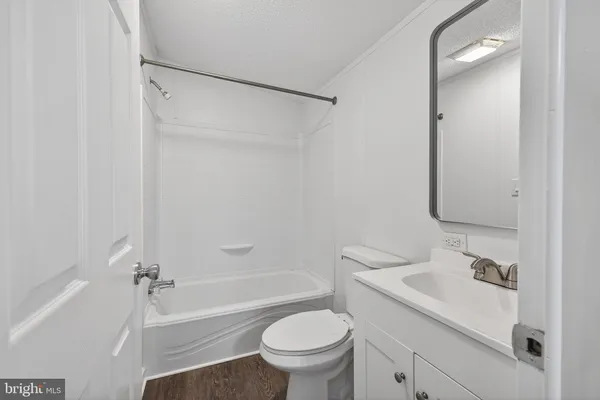 a bathroom with a toilet and a bathtub