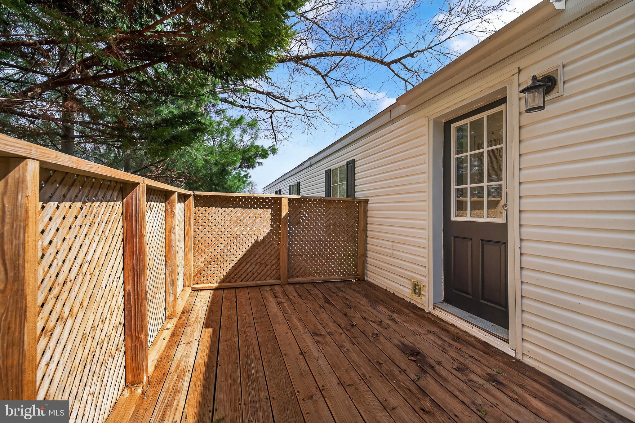 126 Boxwood Road, Unit 126 Middletown, DE 19709 - Photo 23 of 33 Charming deck with serene surroundings.