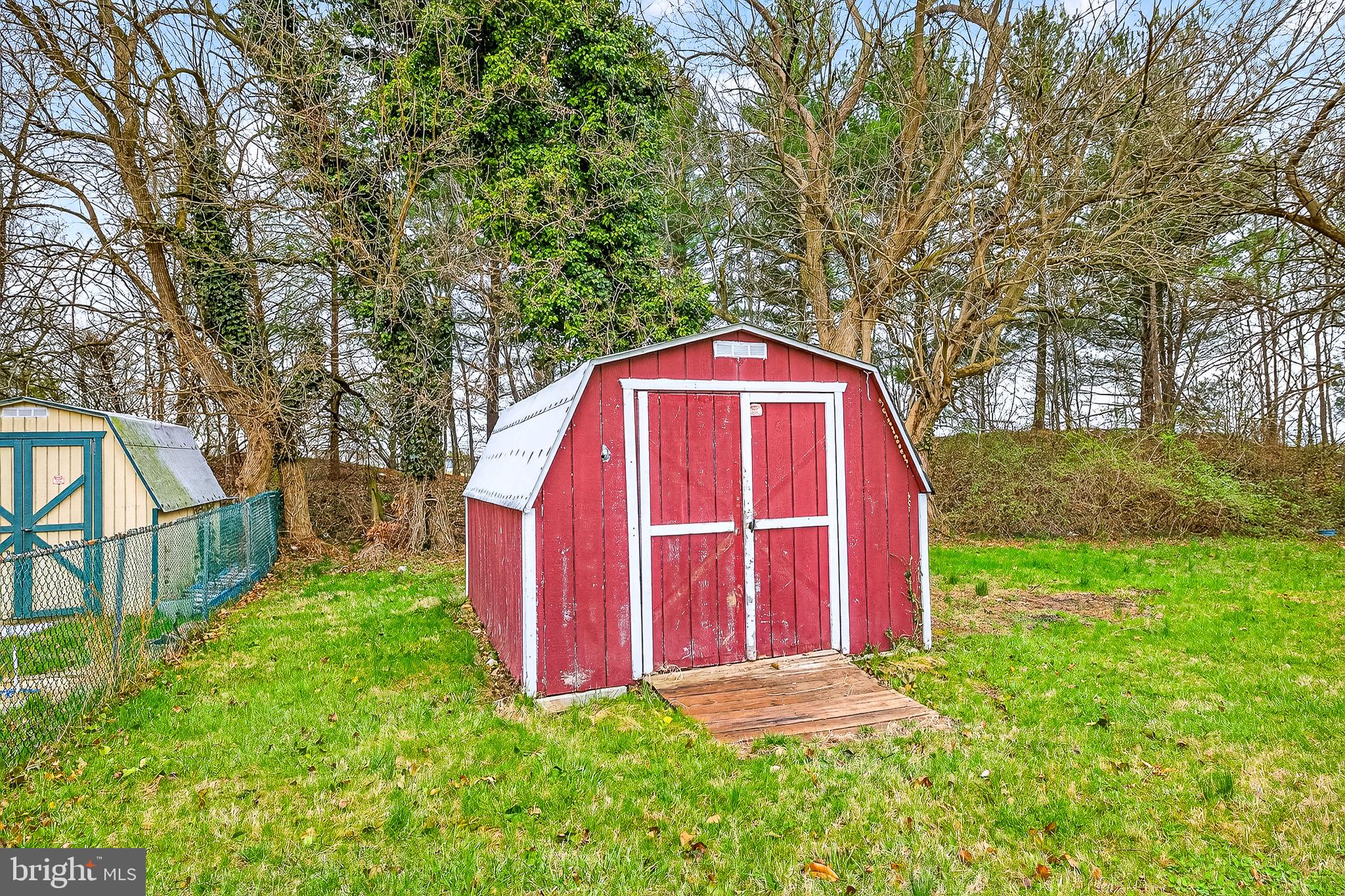 126 Boxwood Road, Unit 126 Middletown, DE 19709 - Photo 32 of 33 Charming red shed in a serene setting.