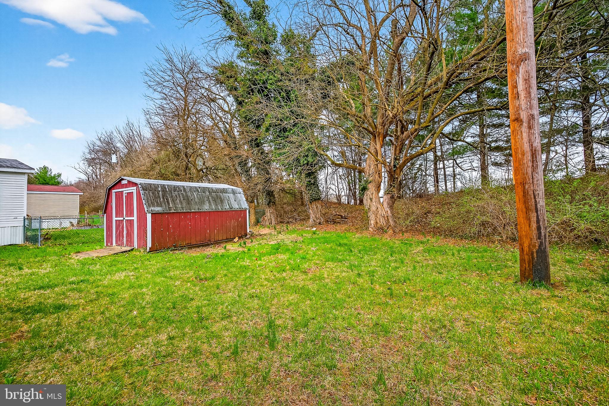 126 Boxwood Road, Unit 126 Middletown, DE 19709 - Photo 33 of 33 Charming backyard with rustic shed.