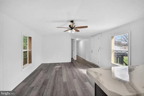 a view of livingroom and hardwood floor