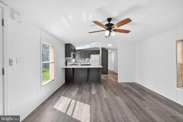 a view of kitchen with cabinets and wooden floor