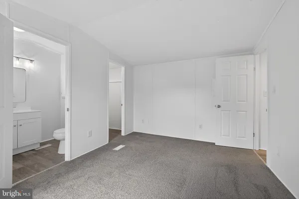 an empty room with a bathroom