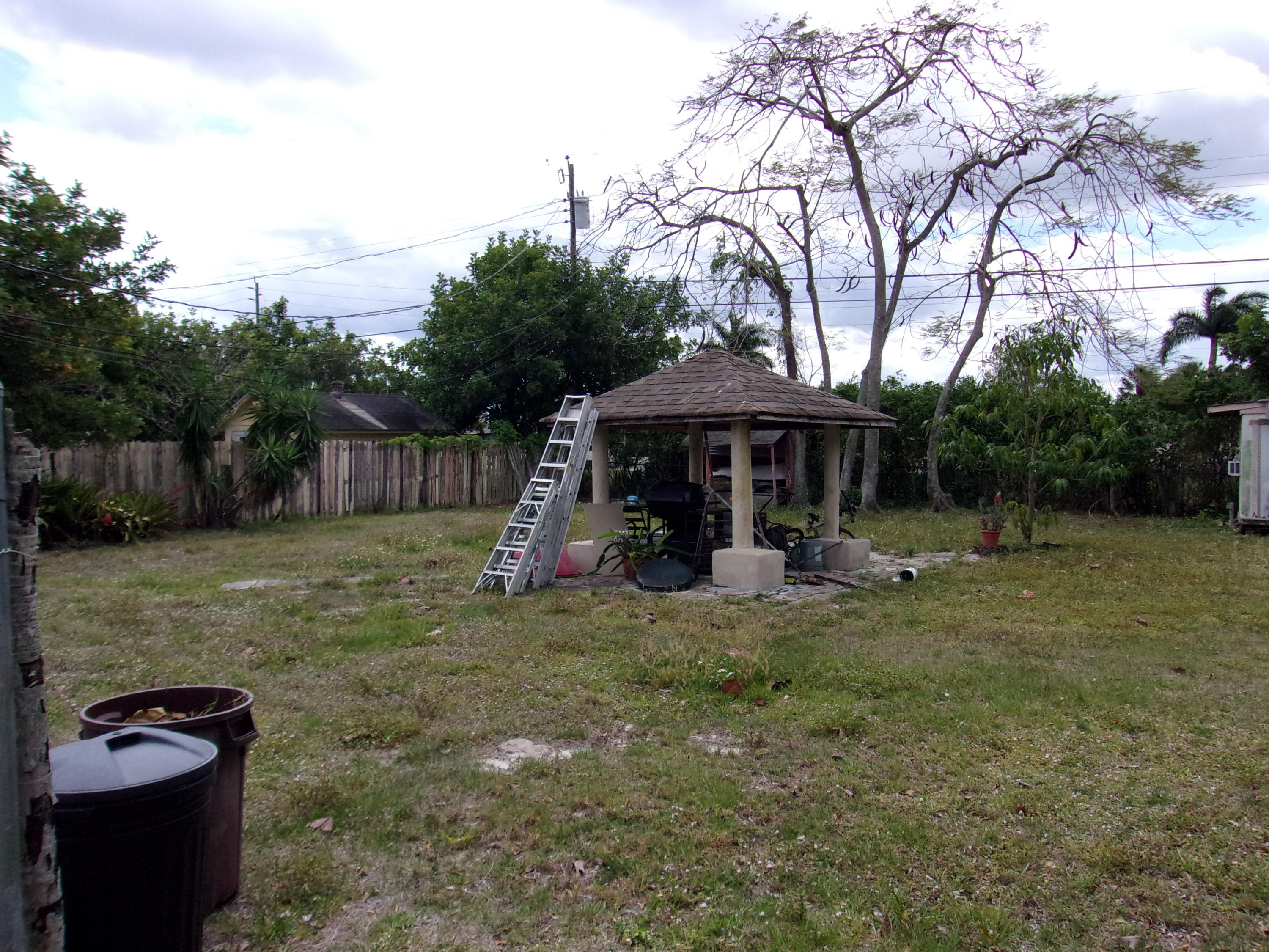 5588 South Rue Road West Palm Beach, FL 33415 - Photo 22 of 29 a view of a house with backyard and sitting area