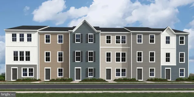 a front view of a building with a yard