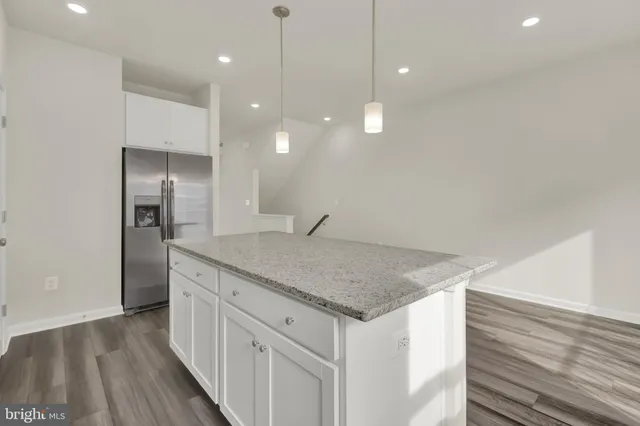 a kitchen with a sink dishwasher and refrigerator