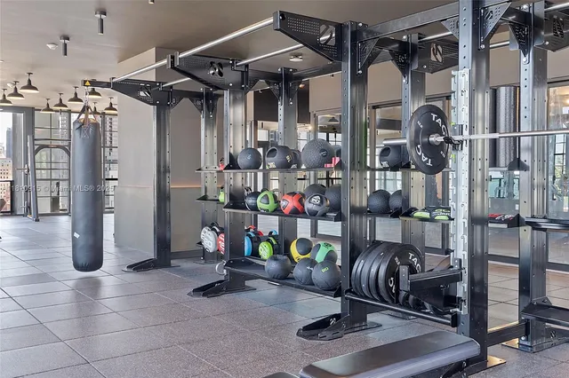a room with lots of gym equipment