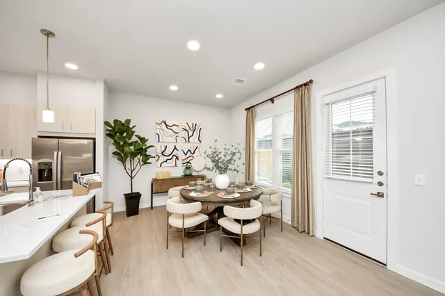 a living room with furniture and flat screen tv
