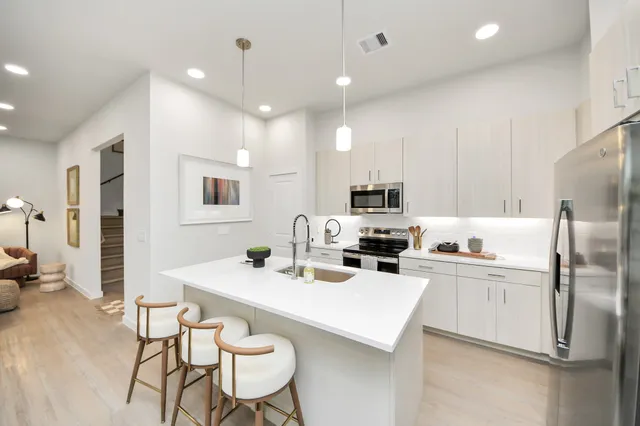 a view of a patio with swimming pool table and chairs