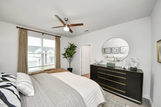 a bedroom with a bed and a dresser