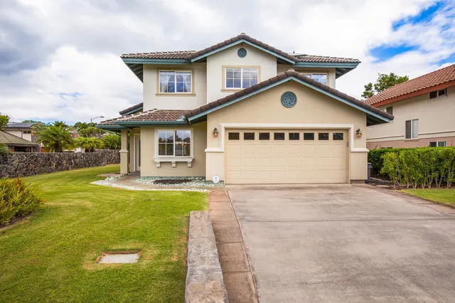 a view of a house with swimming pool and a yard