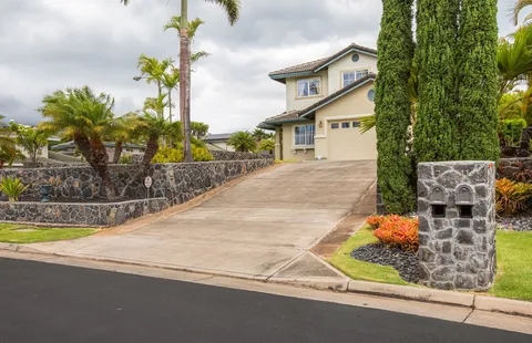 a view of a water fountain in front of a house