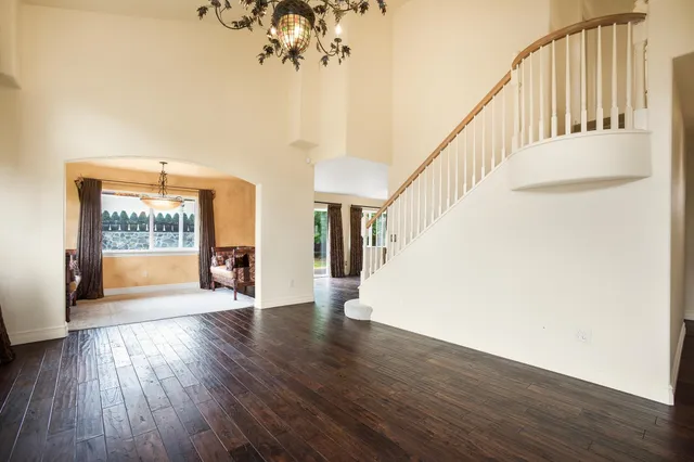 a view of an entryway with wooden floor and windows