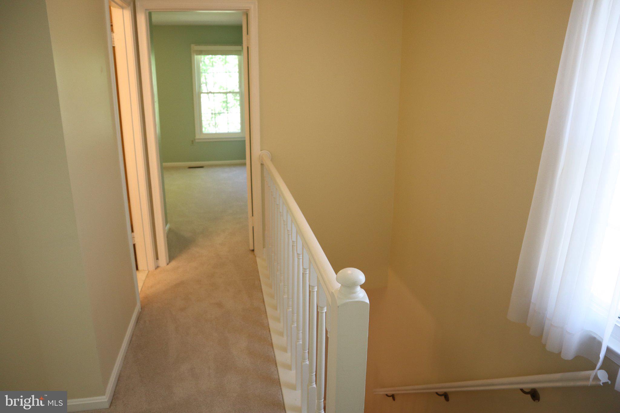 10848 Douglas Avenue Silver Spring, MD 20902 - Photo 13 of 33 a view of a hallway with windows
