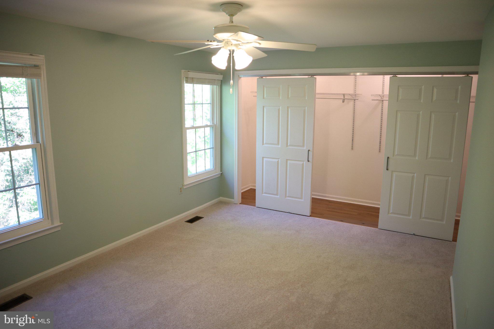 10848 Douglas Avenue Silver Spring, MD 20902 - Photo 15 of 33 an empty room with windows and fan