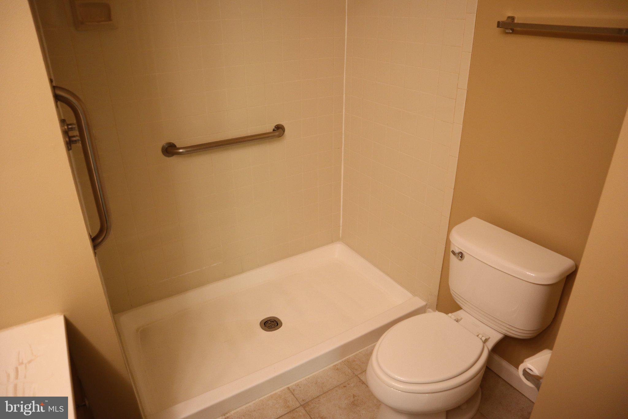 10848 Douglas Avenue Silver Spring, MD 20902 - Photo 18 of 33 a white toilet sitting next to a shower