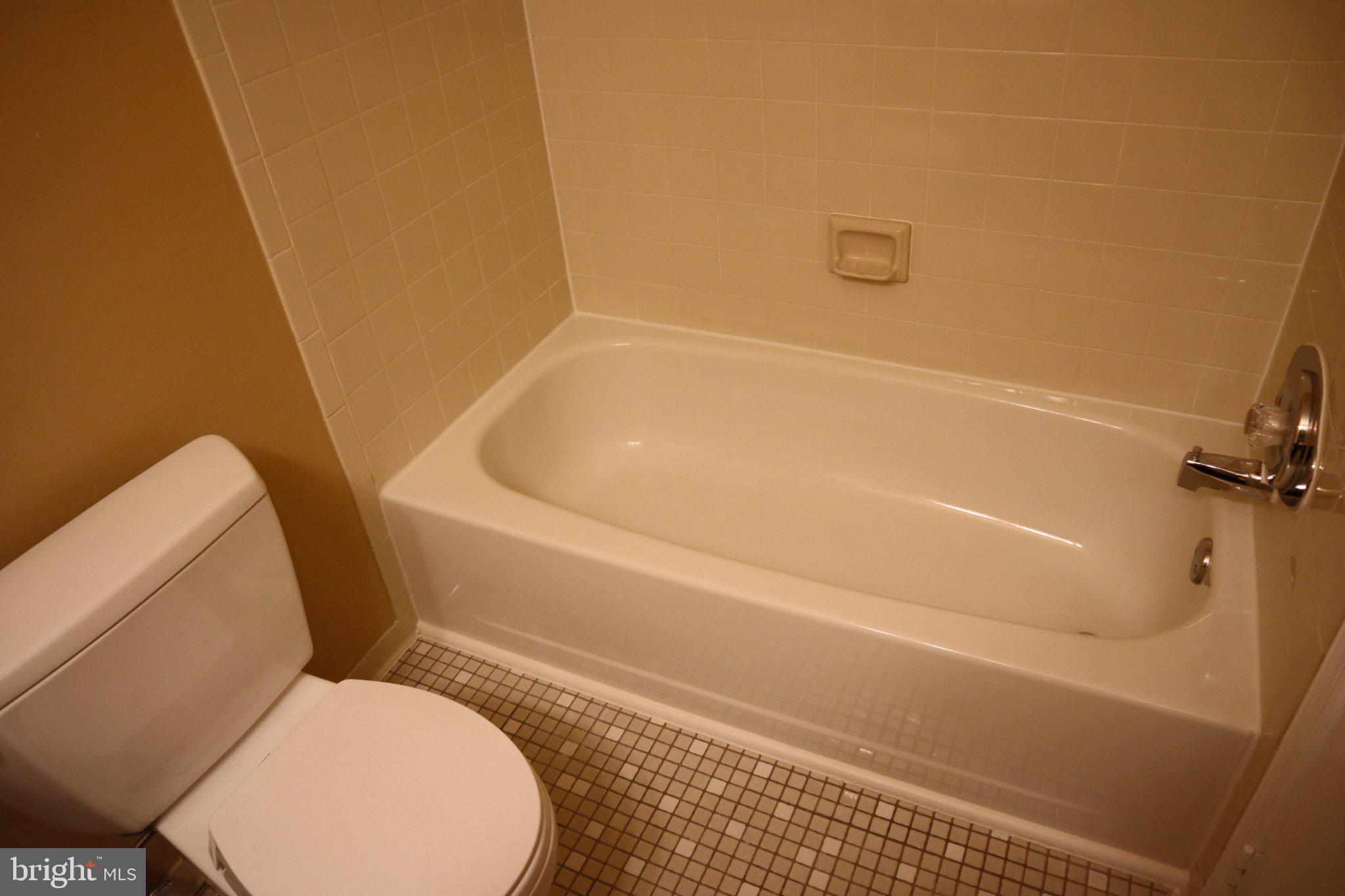 10848 Douglas Avenue Silver Spring, MD 20902 - Photo 21 of 33 a bathroom with a toilet and a bathtub