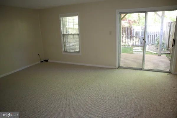 an empty room with a fireplace