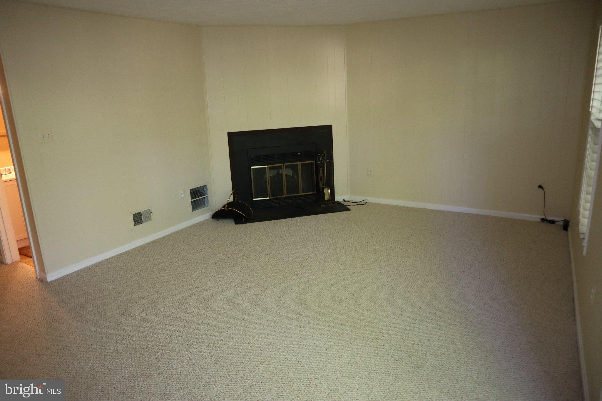 10848 Douglas Avenue Silver Spring, MD 20902 - Photo 27 of 33 an empty room with a fireplace