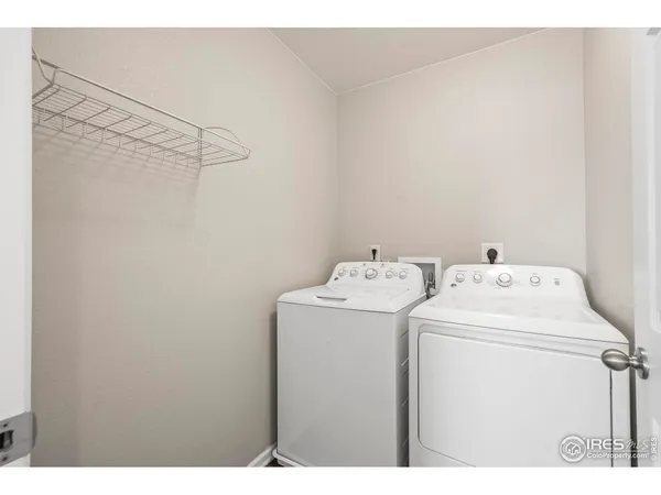 a bathroom with a sink double vanity granite and a mirror
