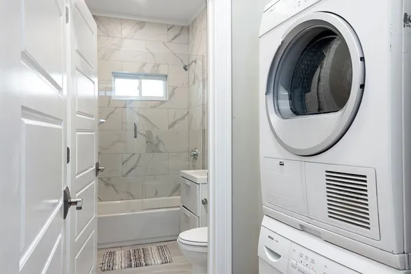 a bathroom with a toilet and a shower