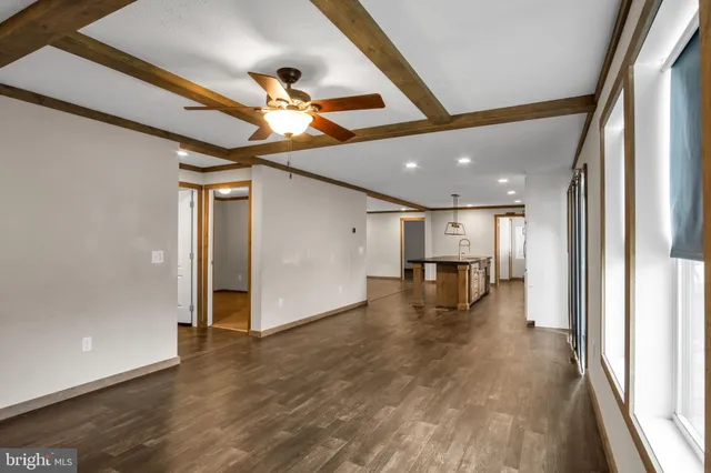 a view of an entryway with wooden floor