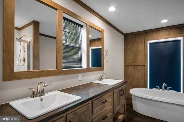 a bathroom with a sink double vanity and a mirror