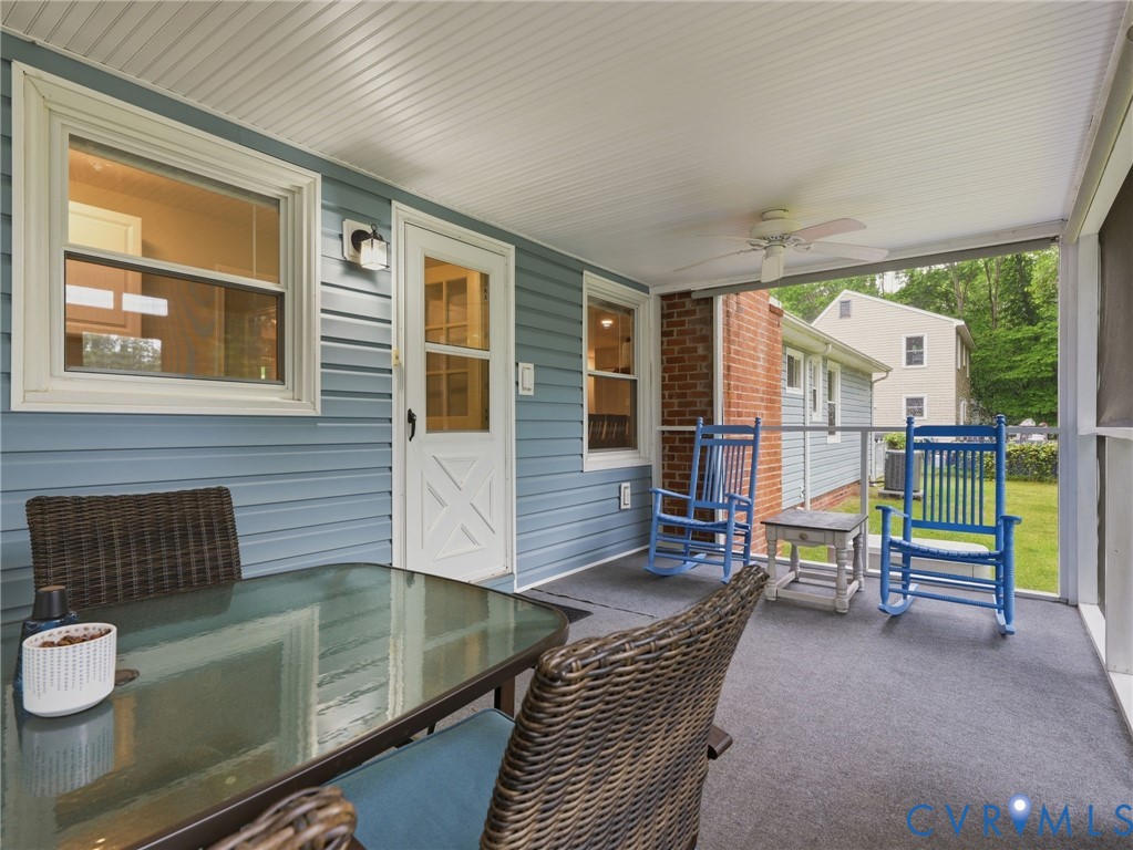 7707 Woodbrook Road Quinton, VA 23141 - Photo 40 of 42 Screened porch featuring light blue siding, a whit