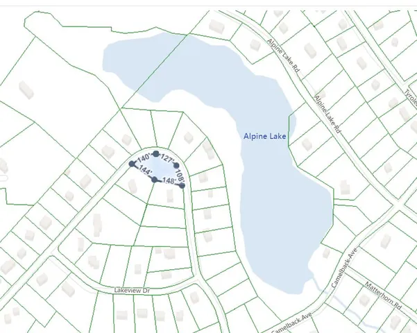 a view of a room with a white walls and a large window