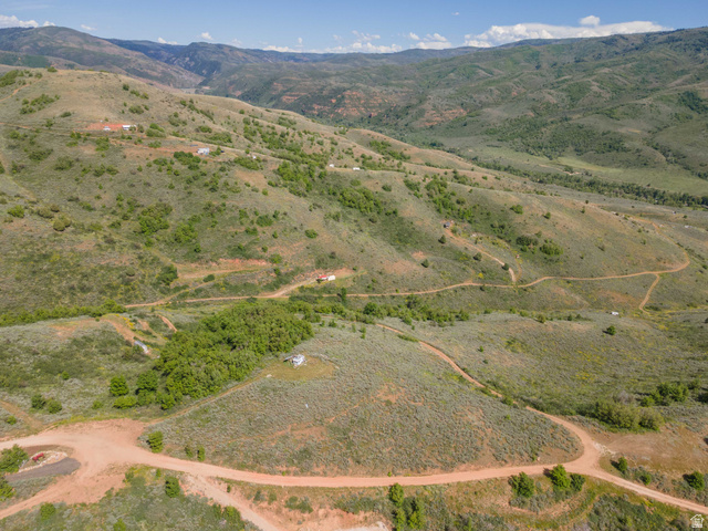 73 North River View Road, Unit 73 Huntsville, UT 84317 - Photo 20 of 21 Expansive hilly terrain featuring scattered green foliage and visible dirt roads