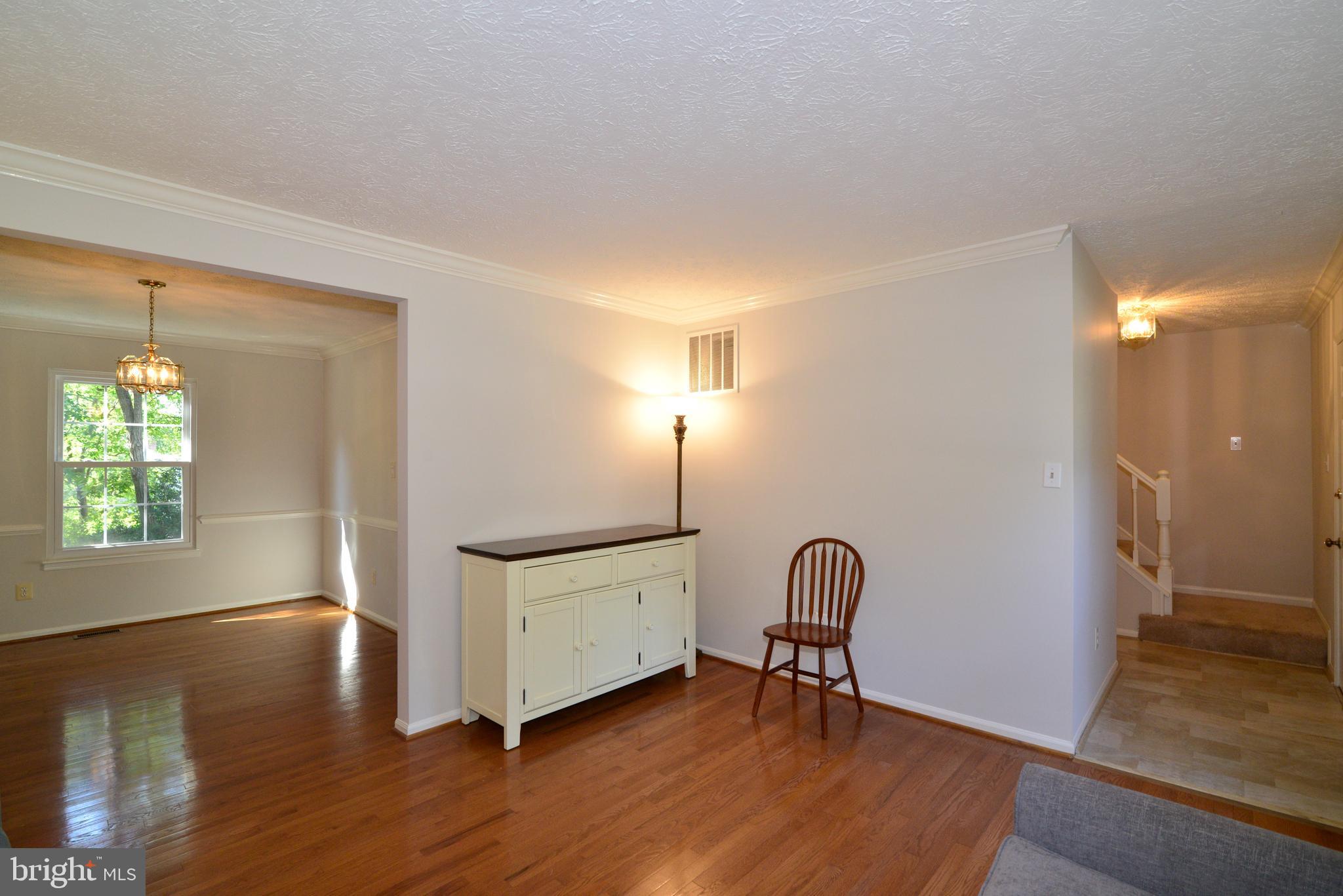 1494 Coat Ridge Road Herndon, VA 20170 - Photo 13 of 37 Living room showing dining room and entryway