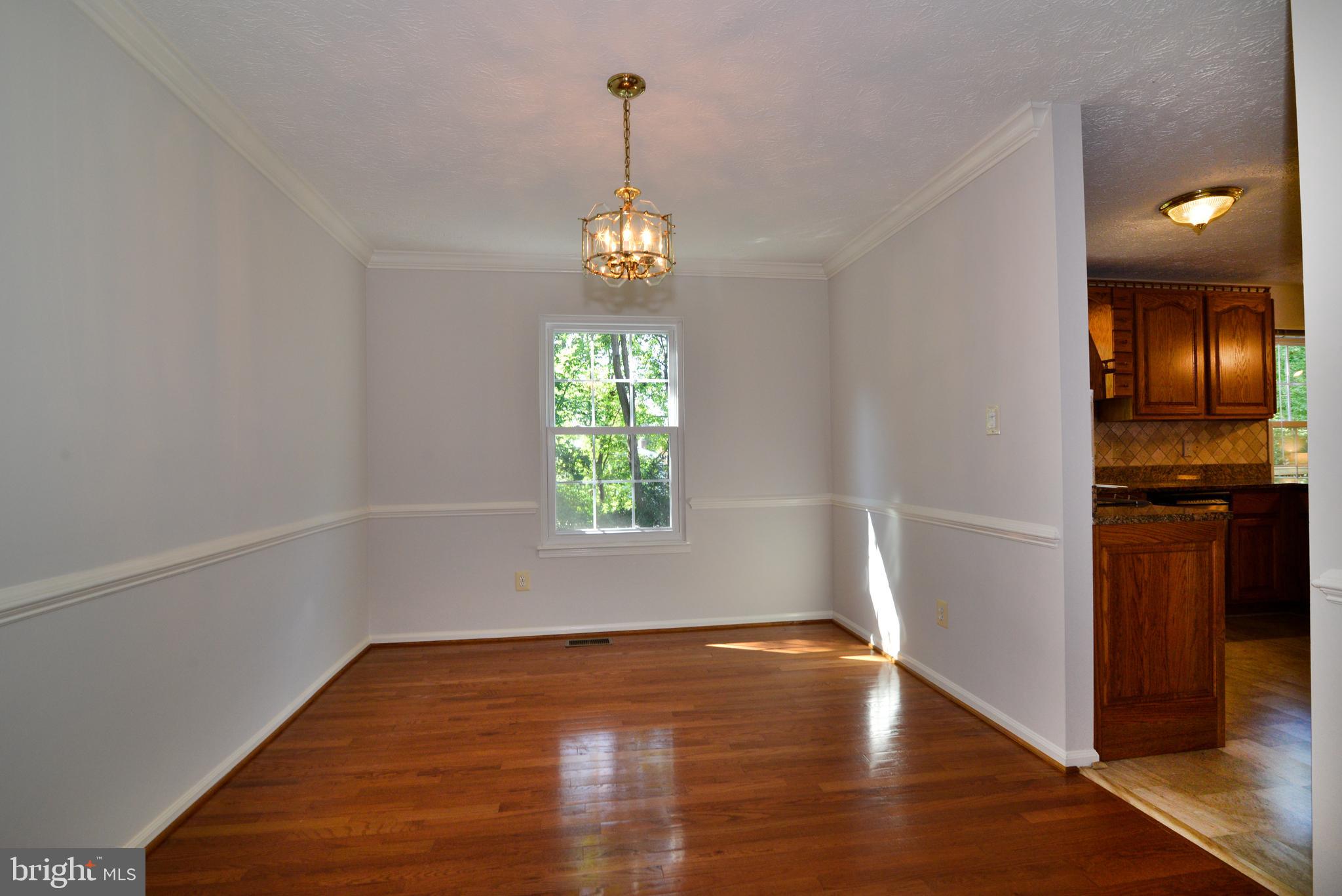 1494 Coat Ridge Road Herndon, VA 20170 - Photo 14 of 37 Dining room with hardwood floors