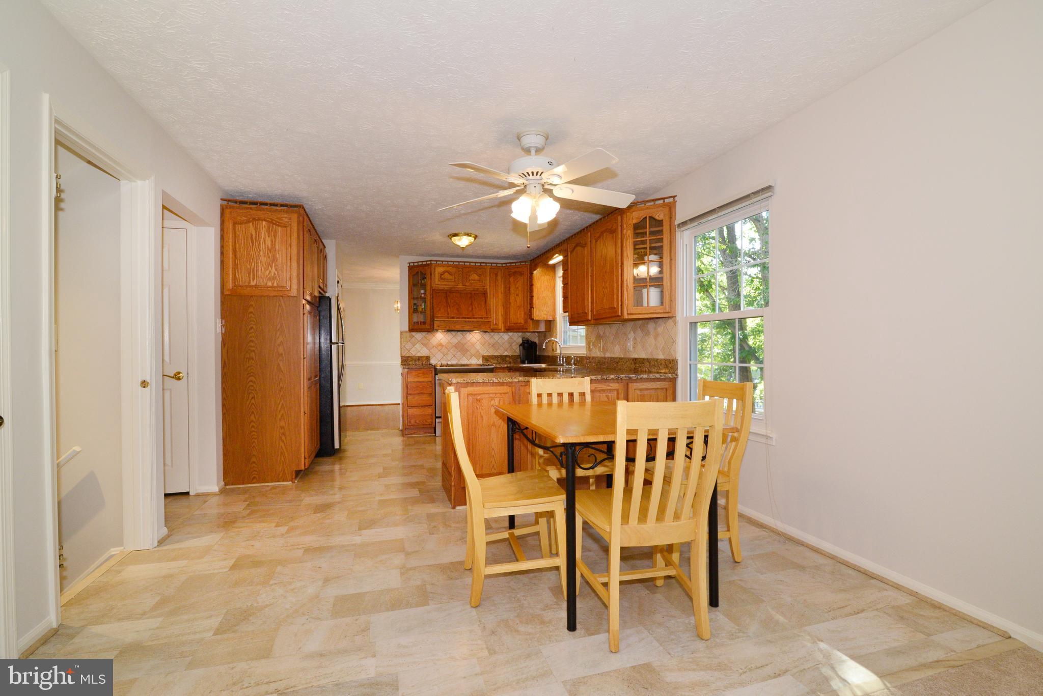 1494 Coat Ridge Road Herndon, VA 20170 - Photo 7 of 37 Main floor kitchen & table space