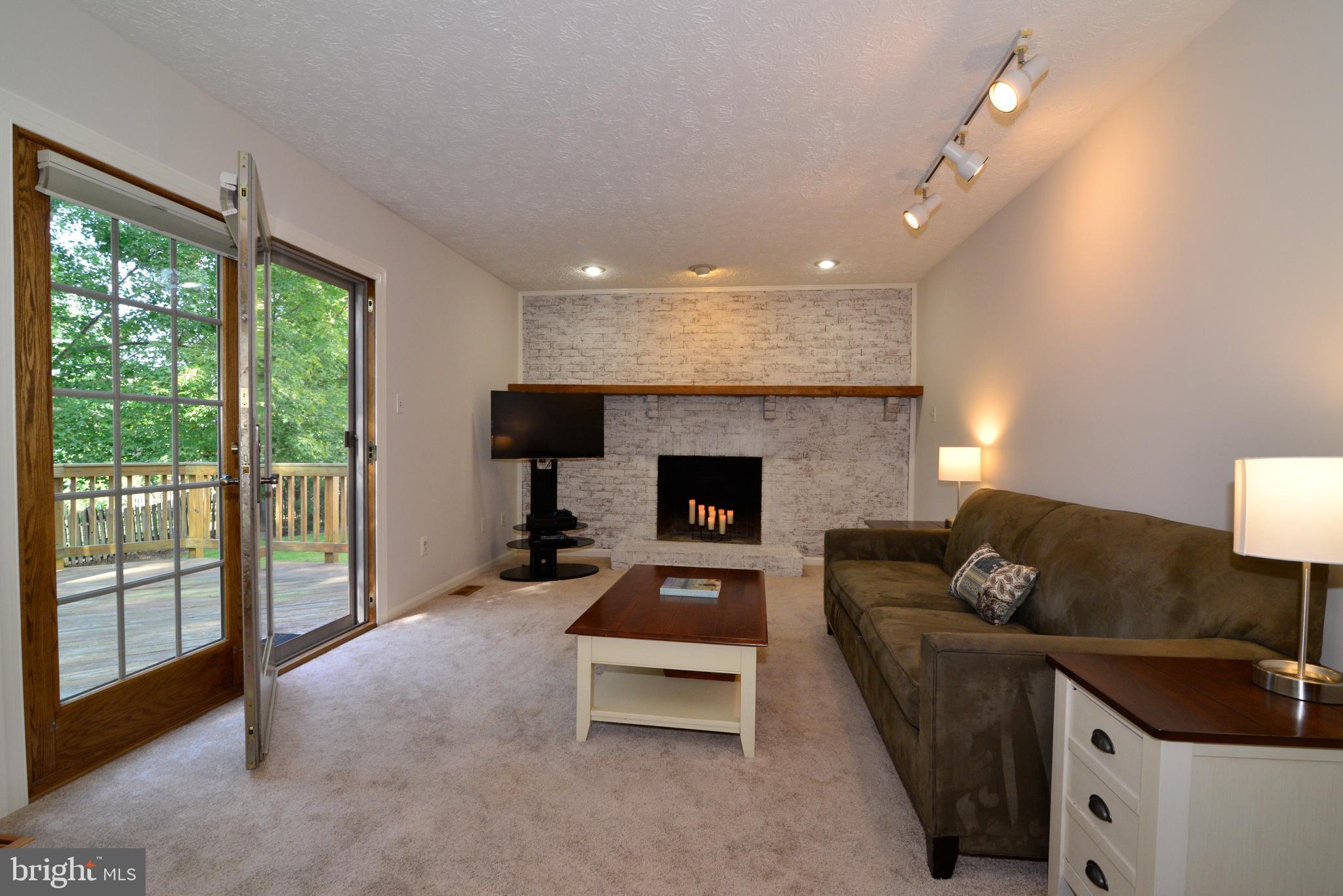 1494 Coat Ridge Road Herndon, VA 20170 - Photo 9 of 37 Main level family room opens to rear deack