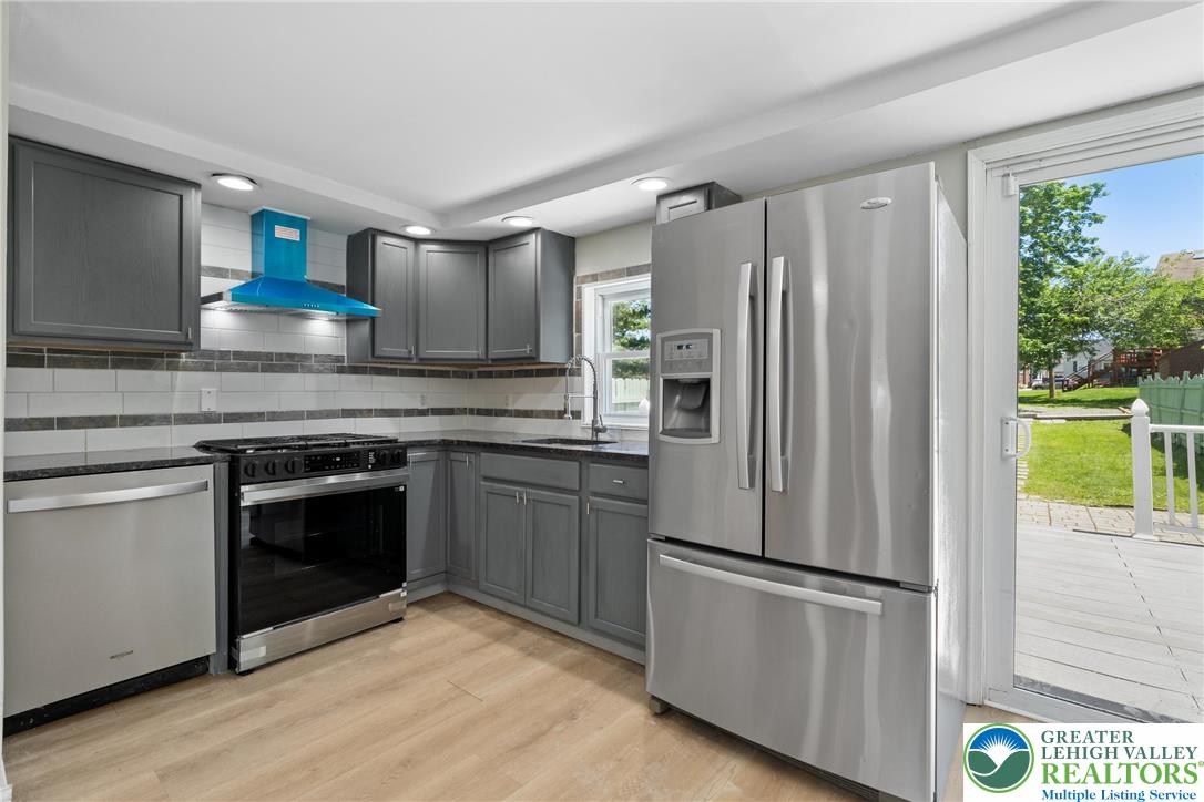 1328 High Street Bethlehem, PA 18018 - Photo 11 of 36 a kitchen with stainless steel appliances granite countertop a refrigerator sink and stove