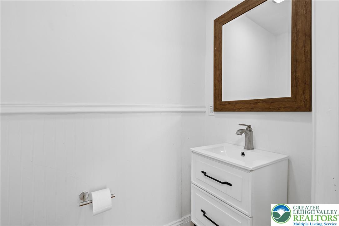 1328 High Street Bethlehem, PA 18018 - Photo 14 of 36 a bathroom with a sink and a mirror