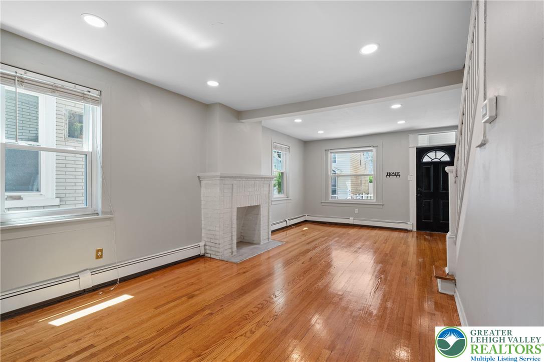 1328 High Street Bethlehem, PA 18018 - Photo 6 of 36 a view of an empty room with wooden floor and a window