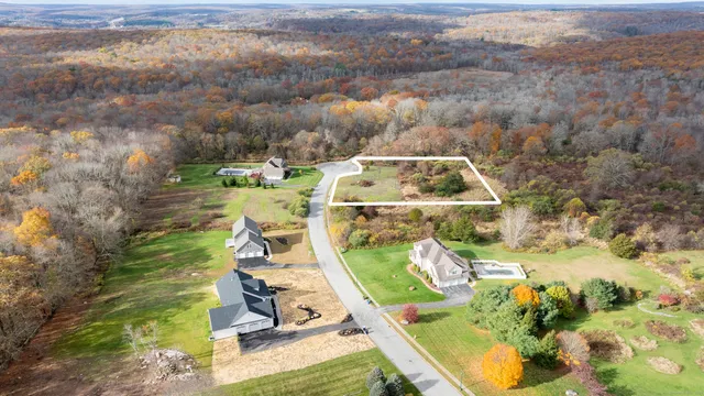 an aerial view of a house with a ocean view