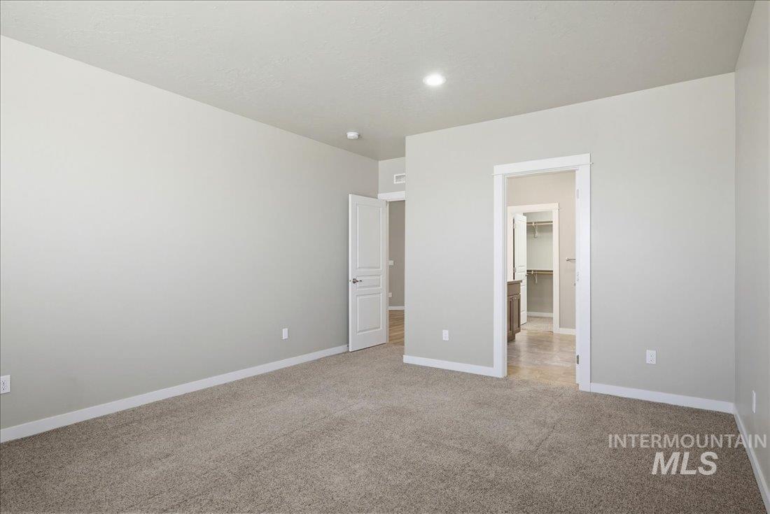 12460 West Azure Street Boise, ID 83713 - Photo 15 of 34 Carpeted room featuring light gray walls, white trim, and recessed ceiling lighting