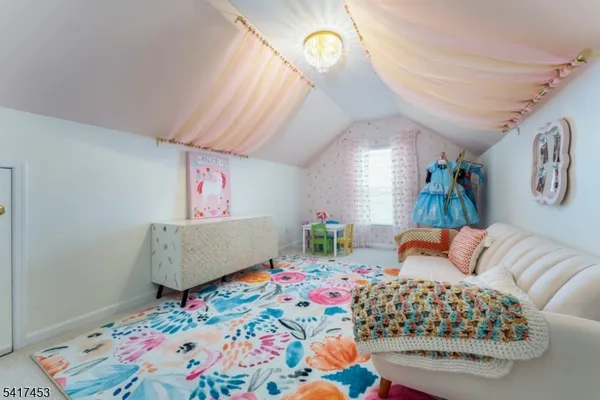 a bedroom with bed and a window