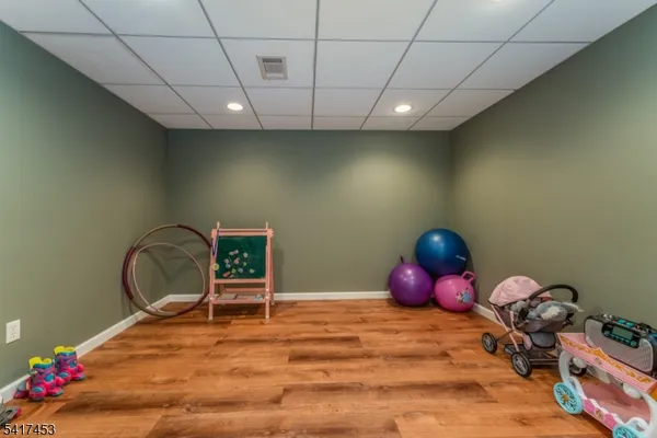 a room with toys and dresser