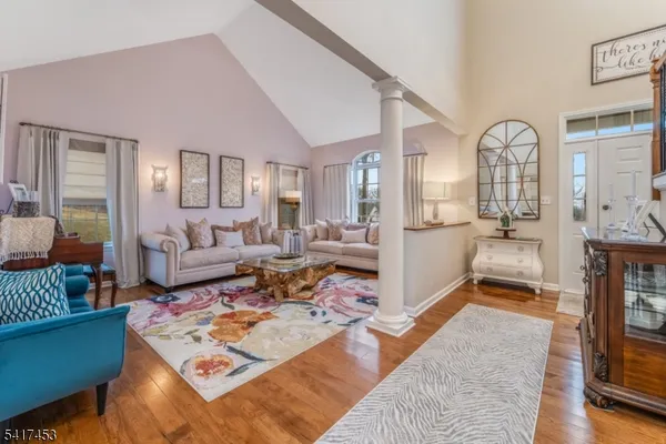 a living room with furniture fireplace and a table