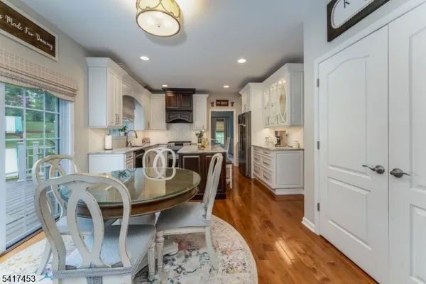 a dining room with furniture and a chandelier