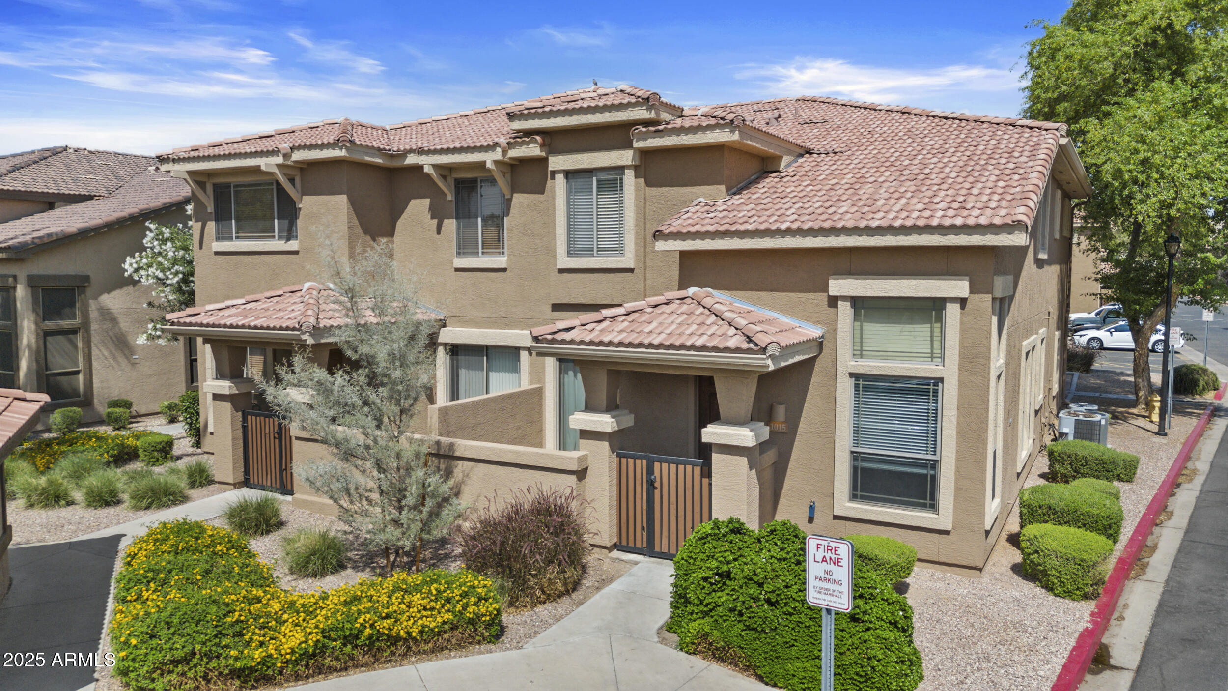 a front view of a house with garden