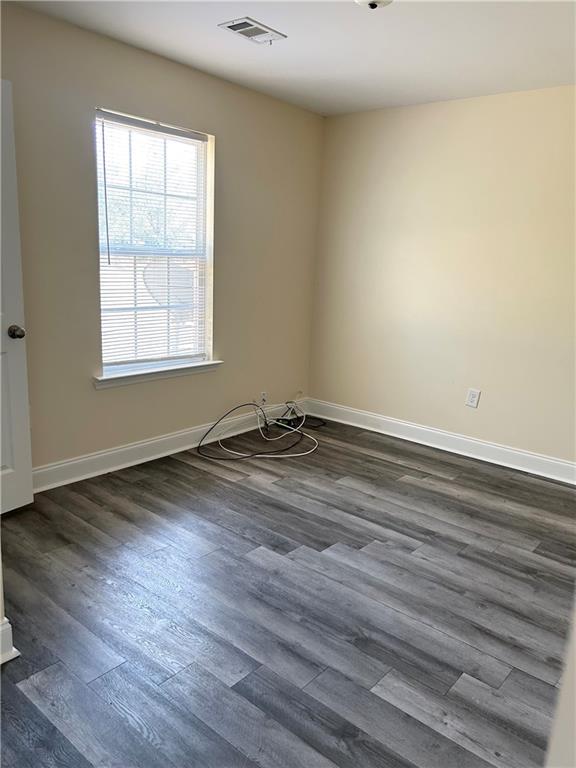 129 Ronald Pride Boulevard, Unit A Fort Valley, GA 31030 - Photo 2 of 11 a view of a room with wooden floor and window
