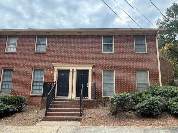 a front view of a house with stairs