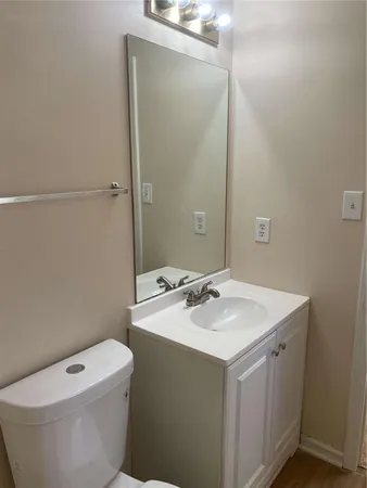 a bathroom with a sink toilet and vanity