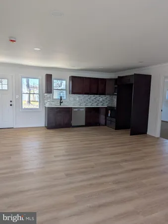 a view of a living room with furniture and a window