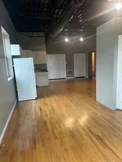 a kitchen with granite countertop a sink and a stove top oven